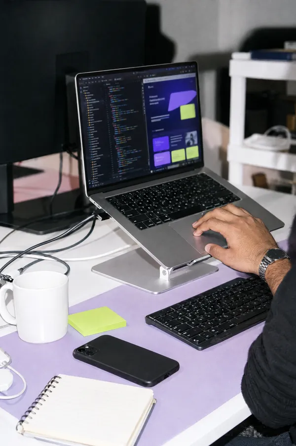 Development: building a website on a laptop at the studio desk